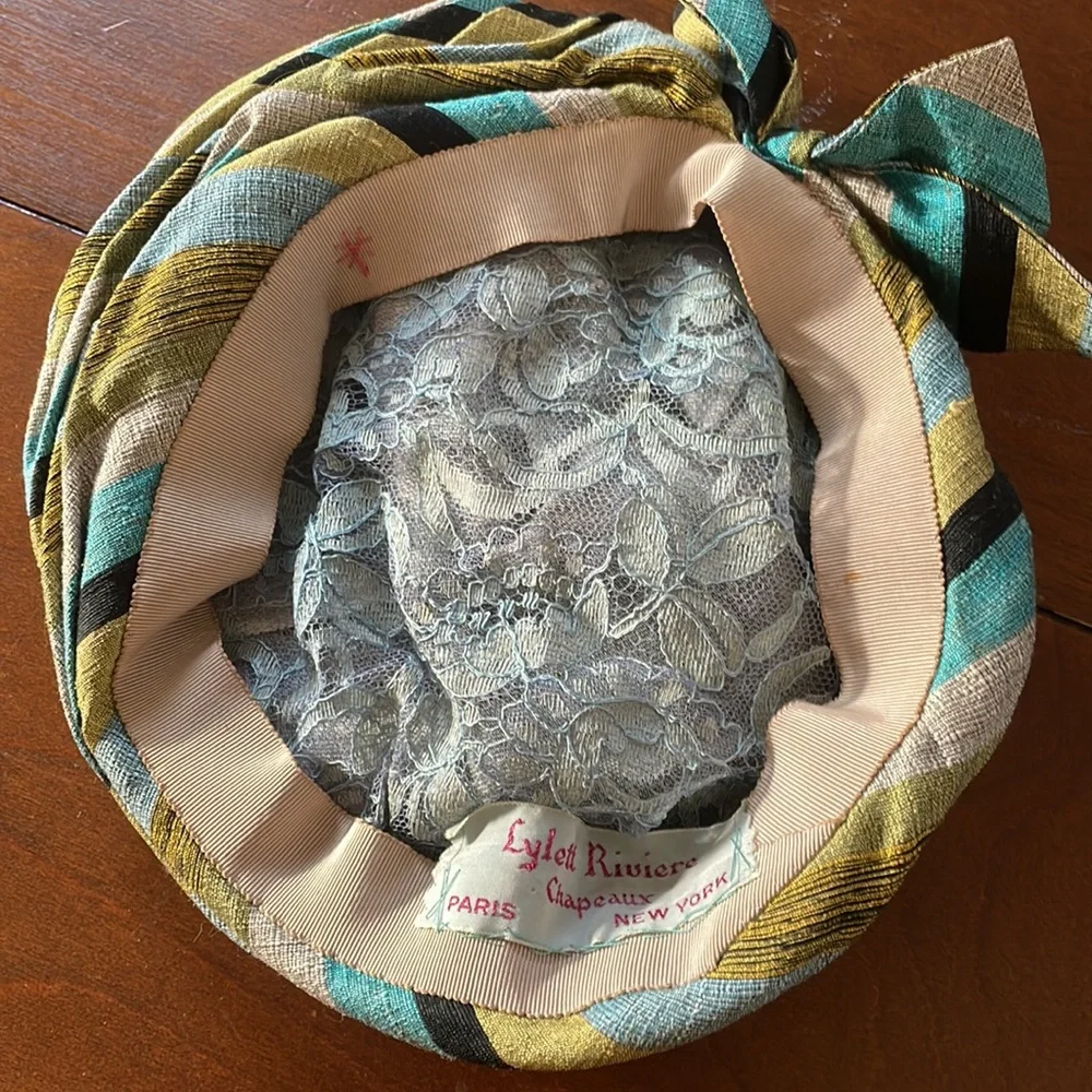 Vintage pin back hat Lynette Riviere